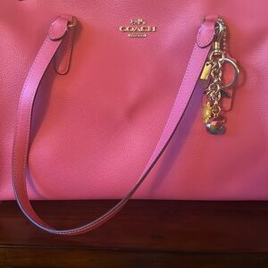 Pink leather Coach bag with strap, never worn or used.